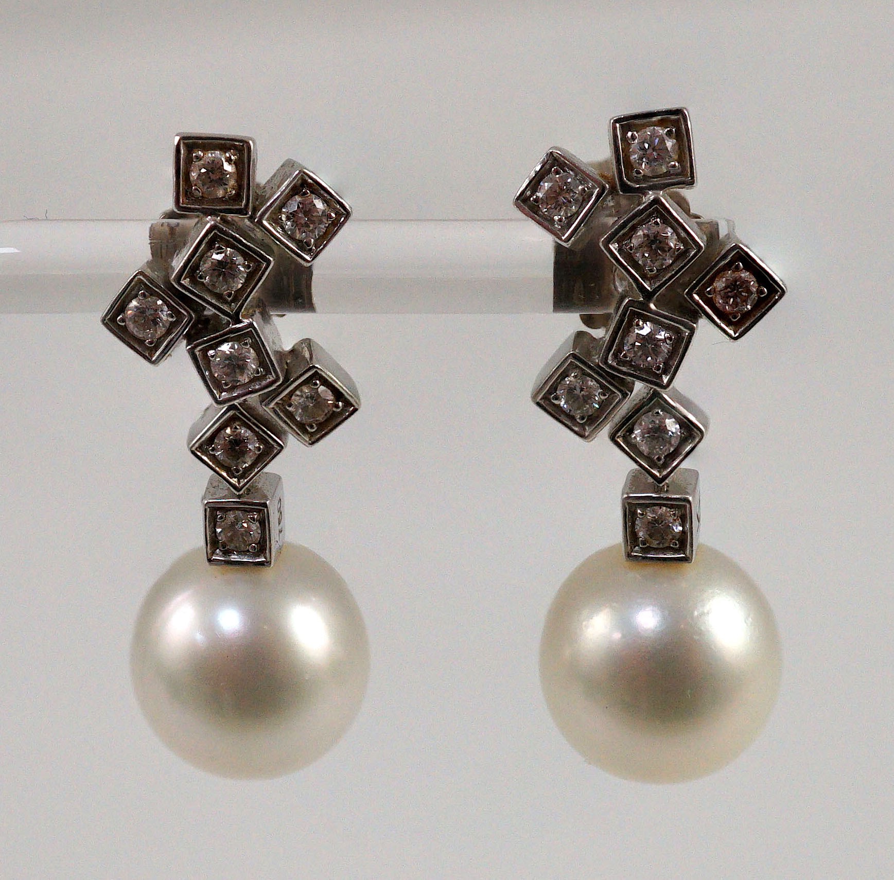 A modern pair of 18ct white gold, single stone South Sea pearl and eight stone diamond cluster set drop earrings, by Kailis